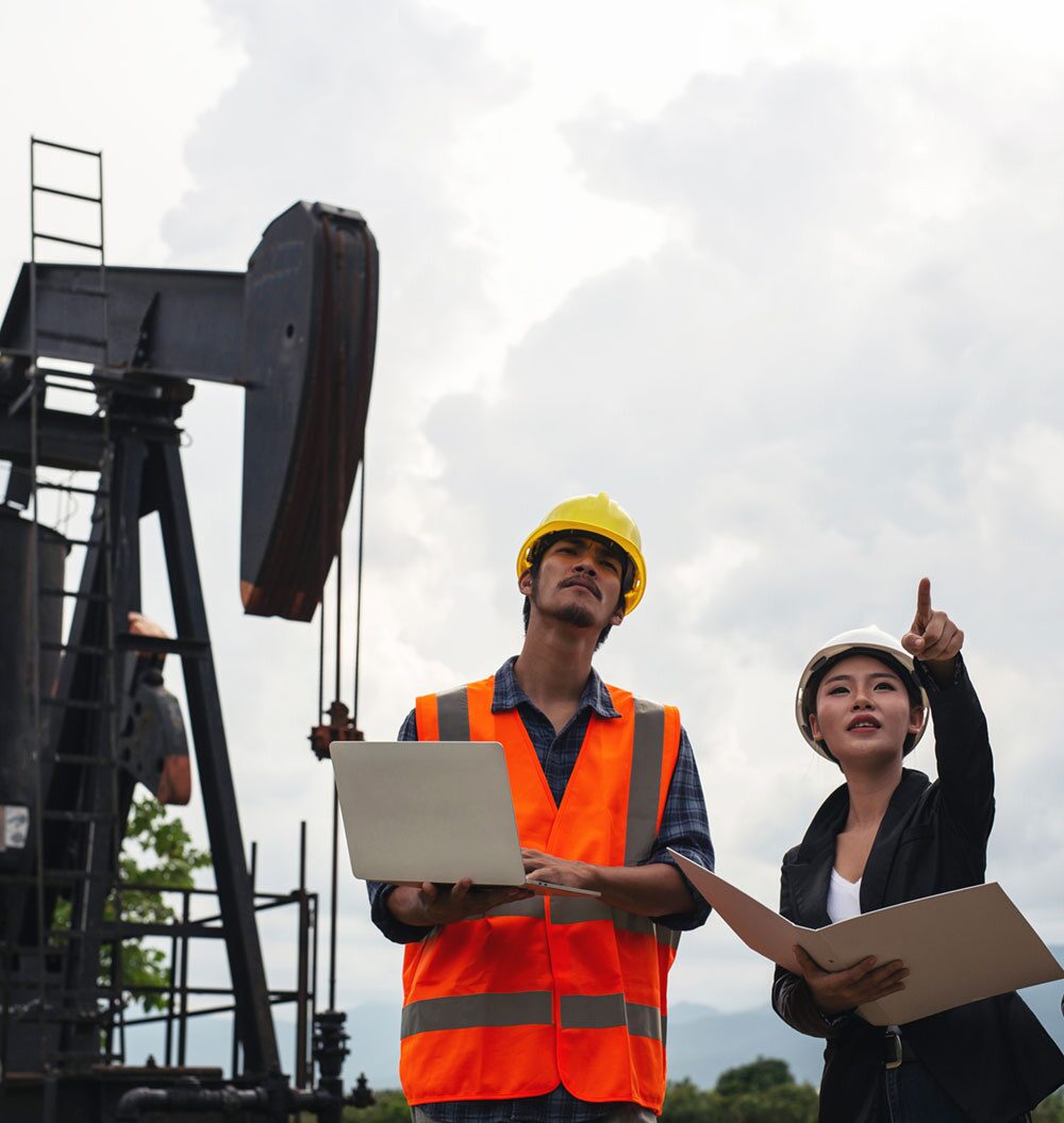 Engineers at a pumpjack site
